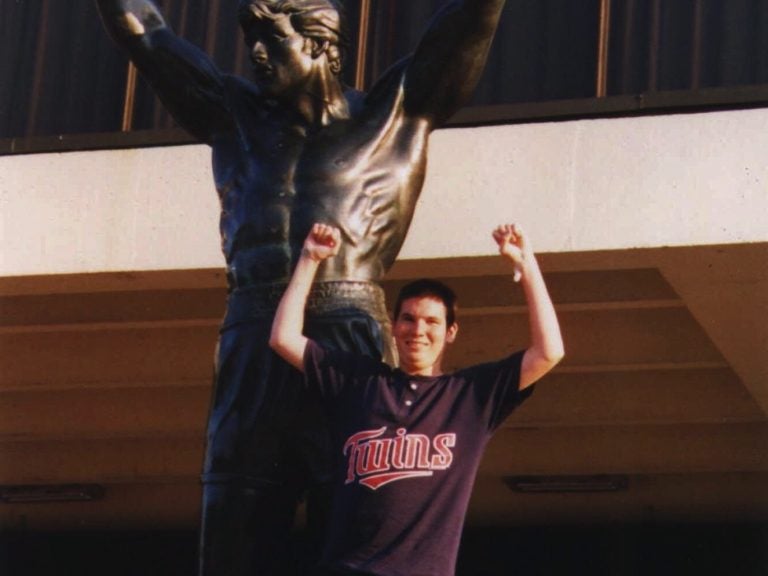 Jesse Gelsinger, 18, in this undated family photo, poses near a statue at the University of Pennsylvania. Gelsinger, who died Sept. 16, 1999, had signed up to be part of an experimental gene therapy study on ornithine transcarbamylase deficiency, or OTC. (Family Photo via The Arizona Daily Star/AP Photo)