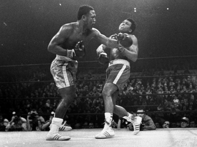 Joe Frazier hits Muhammad Ali with a left during the 15th round of their heavyweight title fight at New York's Madison Square garden in this March 8, 1971 photo. (AP Photo/stf)