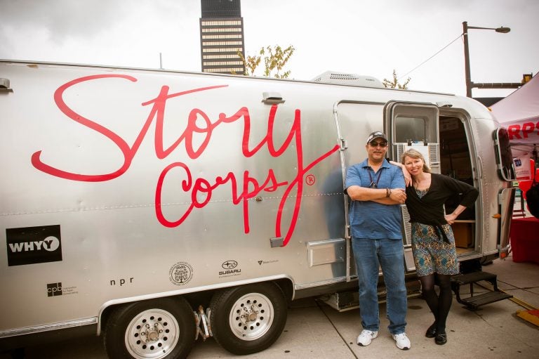 WHYY engineer, Al Banks, left, and WHYY's Morning Edition host, Jennifer Lynn, pose outside the StoryCorps MobileBooth which is parked this month at The Porch at 30th Street Station.  (Laurie Beck Peterson)
