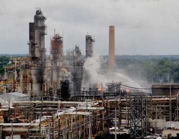 Fire fighters battle flames at the PES refinery in June 2019. (Emma Lee/WHYY)