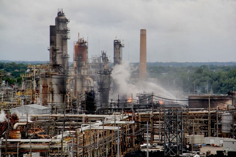 Fire fighters battle flames at the PES refinery in June 2019. (Emma Lee/WHYY)