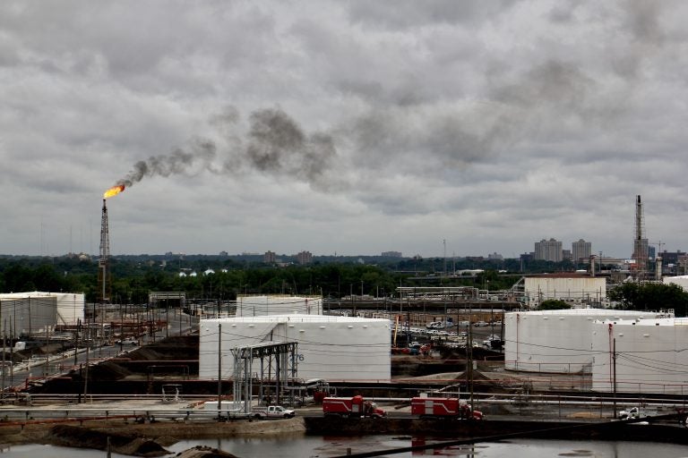 Winds carry a cloud of black smoke from a flare at PES refinery. (Emma Lee/WHYY)