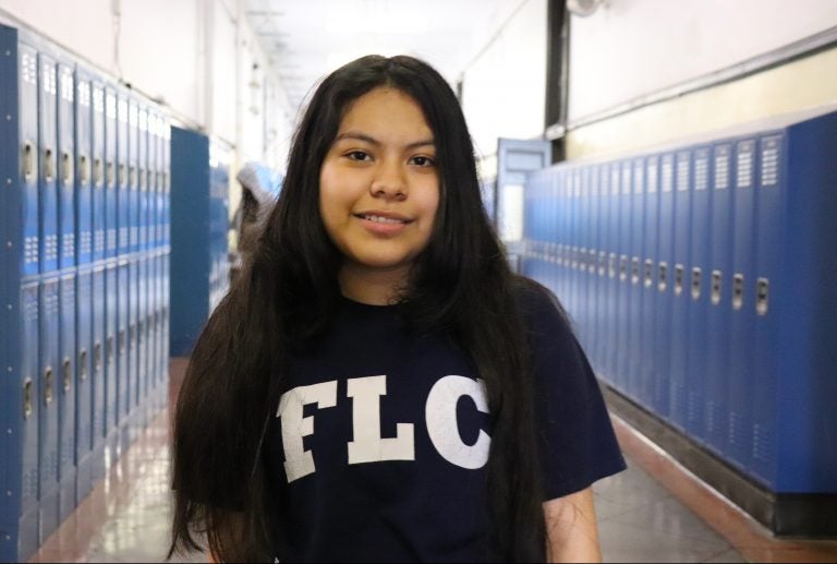 Keyri Artillero, 14, stands in the hallway of Franklin Learning Center, right outside of La Puerta Abierta's meeting room. 
 (Elizabeth Estrada/WHYY)