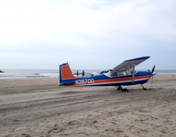 A plane on an Ocean City beach after an emergency landing Saturday morning. (Image courtesy of the Ocean City Police Department)