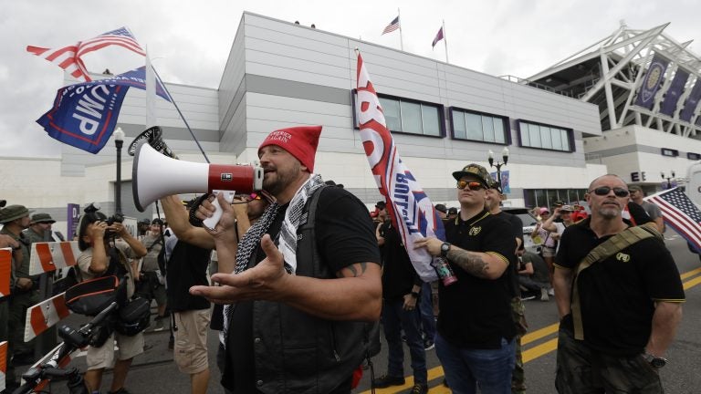 A group from the Proud Boys confronts anti-Trump protesters outside Trump's 2020 campaign kickoff rally Tuesday in Orlando, Fla. The Proud Boys group is known for white nationalist and other extremist rhetoric. (Chris O'Meara/AP Photo)