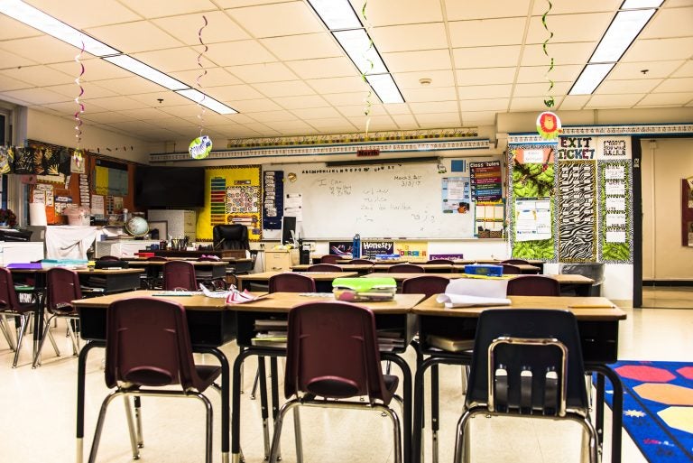 School concept. Back to school, School classroom with empty school chairs and tables, classroom without students, School supplies on blackboard, School of Schoolchild and student education.