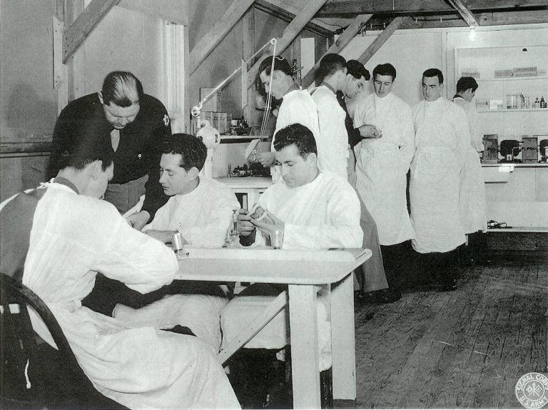 Capt. Charles W. Felt (in black tunic in background) training members of the U.S. Army Dental Corps at the 186th General Hospital, Fairford, UK. (Courtesy U.S. Army, National Archives, Washington, DC.)