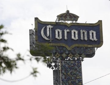 A Corona beer billboard is displayed at the Grupo Modelo beer factory, maker of Corona beer, in Mexico City, Mexico, Friday, May 31, 2019. If the tariffs threatened by United States President Donald Trump on Thursday were to take effect, they could eventually raise prices in the US, for a new Chevrolet Blazer SUV, a burrito at Chipotle, a new shirt or a Corona beer. (AP Photo/Ginnette Riquelme)