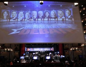 A monitor displays the Democratic presidential candidates that will appear during the second night of the Democratic primary debate hosted by NBC News at the Adrienne Arsht Center for the Performing Arts, Wednesday, June 26, 2019, in Miami. (AP Photo/Brynn Anderson)
