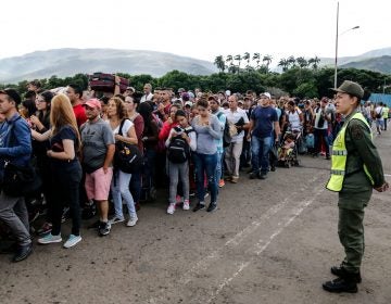 People line up to cross the Simon Bolivar international bridge from San Antonio del Tachira in Venezuela to Cucuta, in Colombia, to buy goods due to supplies shortage in their country. Venezuela's President Nicolás Maduro ordered the reopening of the country's border with Colombia on Friday. (SCHNEYDER MENDOZA/AFP/Getty Images)