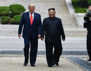North Korea's leader Kim Jong Un walks with President Trump north of the Military Demarcation Line that divides North and South Korea, in the Joint Security Area (JSA) of Panmunjom in the Demilitarized zone (DMZ) on Sunday. (Brendan Smialowski/AFP/Getty Images)