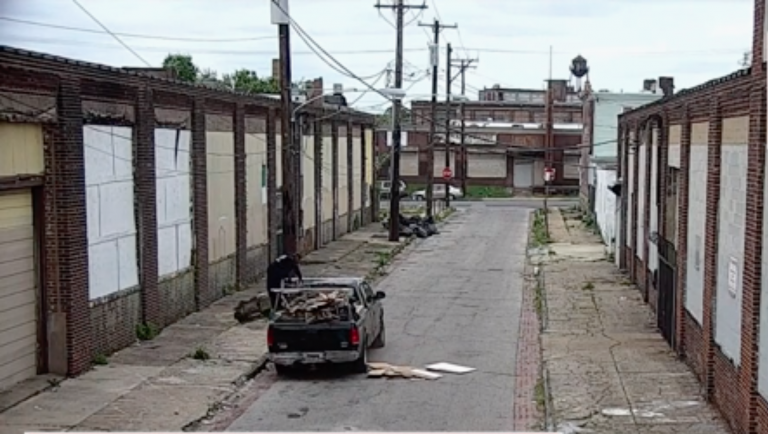 Illegal dumpers throw construction debris on a Philadelphia street in a video screen capture from a video released by the City of Philadelphia.