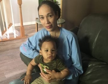 Natalie Lynch at home with her youngest child, Maycen. In 2014, when Lynch was pregnant with her older child, she spent two weeks before giving birth in a prison cell, mostly alone. (Sarah McCammon/NPR)