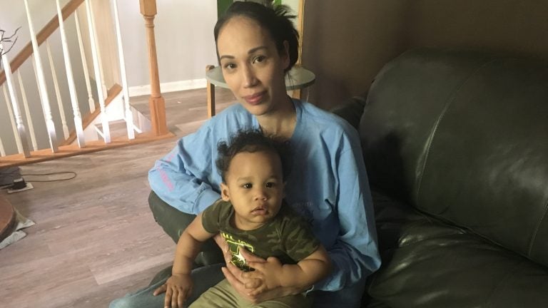 Natalie Lynch at home with her youngest child, Maycen. In 2014, when Lynch was pregnant with her older child, she spent two weeks before giving birth in a prison cell, mostly alone. (Sarah McCammon/NPR)
