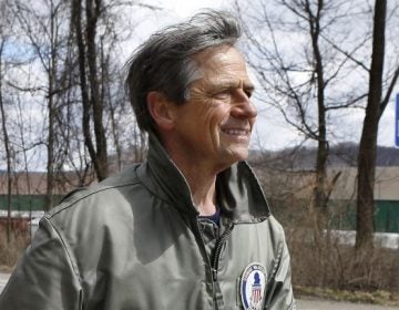 Former U.S. Rep. Joe Sestak, passing a sign marking the Pennsylvania-Ohio state border at the end of his 