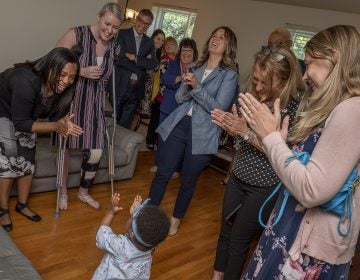 Symphony Ramson plays on the floor of the new apartment she and her dad will live in for a year. (Courtesy of Bergen Rental Communities)