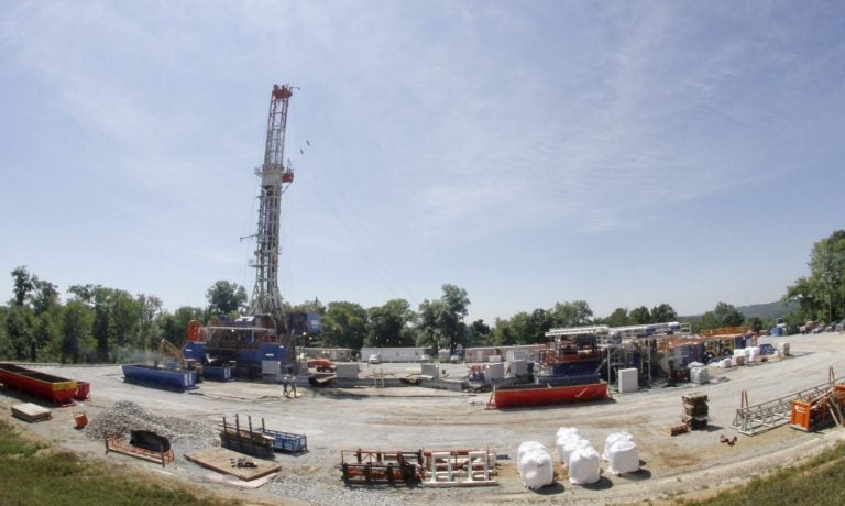 In this July 27, 2011 photo, the sun shines over a Range Resources well site in Washington, Pa. In 2018, Range paid the highest impact fee of any driller in Pennsylvania. (Keith Srakocic / Associated Press)