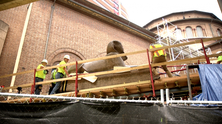 The Penn Museum used “glorified hoverboards” to lift its 13-ton ancient Egyptian sphinx to its new home at the entrance, where it will greet visitors. (Kimberly Paynter/WHYY)