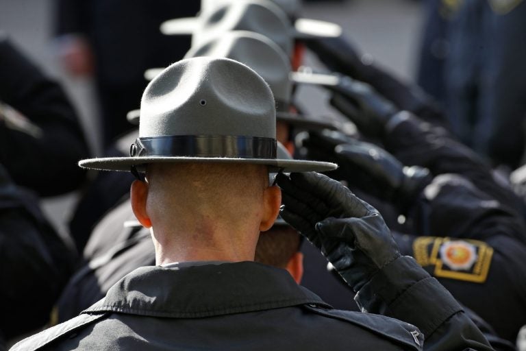 State Police salute in Johnstown. (Gene J. Puskar/AP Photo)