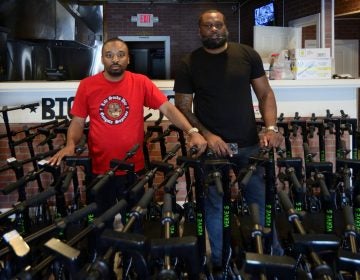 CEO Kevin Thompson and COO Naim Statham present their fleet of close to a hundred Verve E-scooters, stored at a former hamburger take-out restaurant located at the corner of Roosevelt Blvd and F Street, on June 15, 2019. (Bastiaan Slabbers for WHYY)