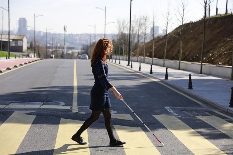 Students walking together at school, Blind or partially sig…