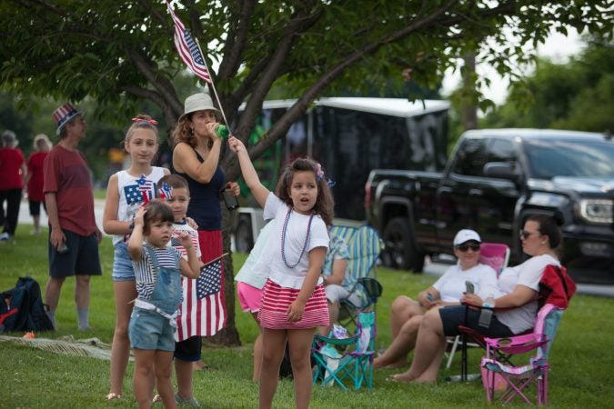 Bora Hila, 6 (center), whose family is from Albania celebrates the Fourth of July at the Marple Newtown parade. (Emily Cohen for WHYY)