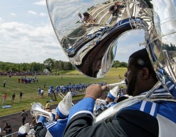 Members of the Cheyney University marching band play in the stands during a football game against Lincoln University. (Bastiaan Slabbers for WHYY)