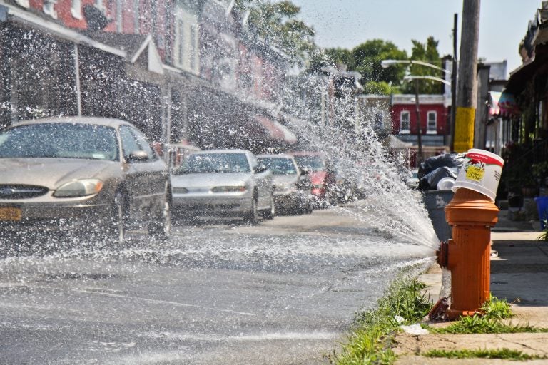 Open fire hydrant during heatwave in Philadelphia