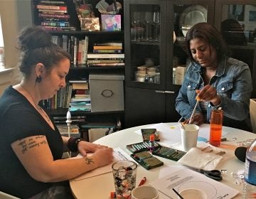 Art therapist Jessica Masino Drass (left) works with Derricia Smith. (Anne Hoffman)