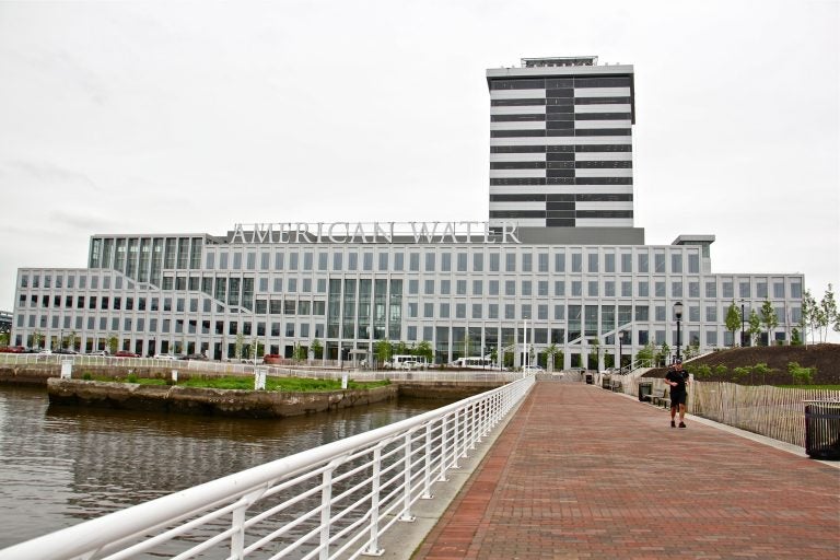 Developments on the Camden waterfront, like the American Water corporate headquarters and the 18-story Camden Tower, receive substantial local tax breaks in addition to state tax incentives. (Emma Lee/WHYY)