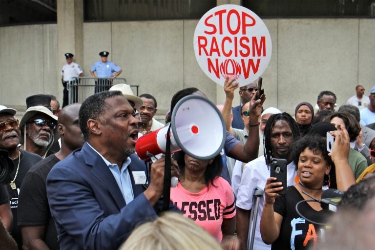 About 200 protesters gather at Philadelphia police headquarters to call for action against police officers who posted racist comments on Facebook. (Emma Lee/WHYY)