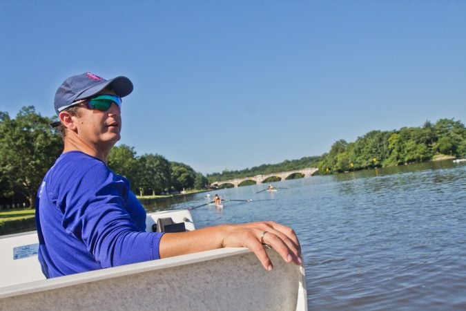 Rowing coach John Cohn evaluates rowers at the Mid-Atlantic U.S. Olympic Development Program program on the Schuylkill in Philadelphia. (Kimberly Paynter/WHYY)