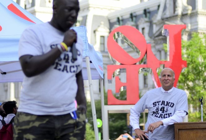 1nd District Councilperson Mark Squilla listens to Cheick Diawara  during the Stand 4 Peace anti gun-violence rally in Love park, on July 2, 2019. (Bastiaan Slabbers for WHYY)