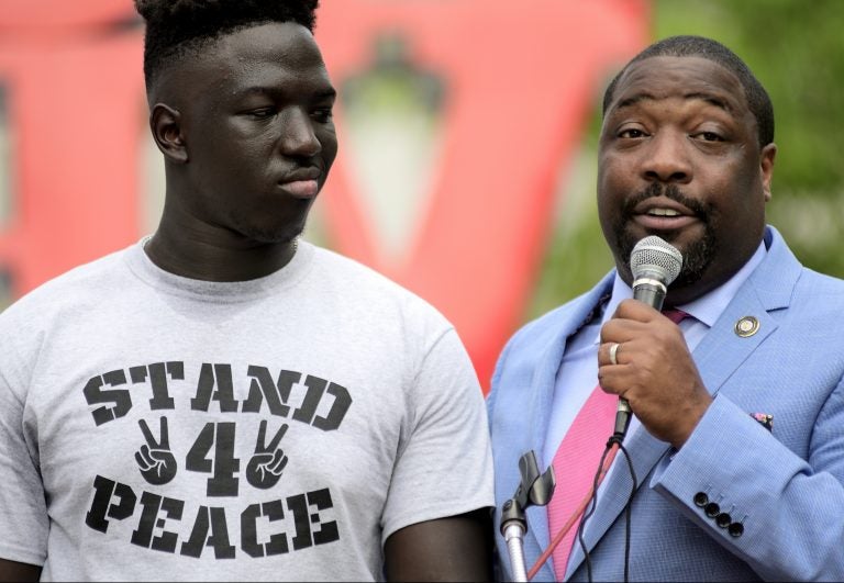 2nd District Councilperson Kenyatta Johnson stands next to Cheick Diawara during the Stand 4 Peace anti gun-violence rally in Love park. (Bastiaan Slabbers for WHYY)