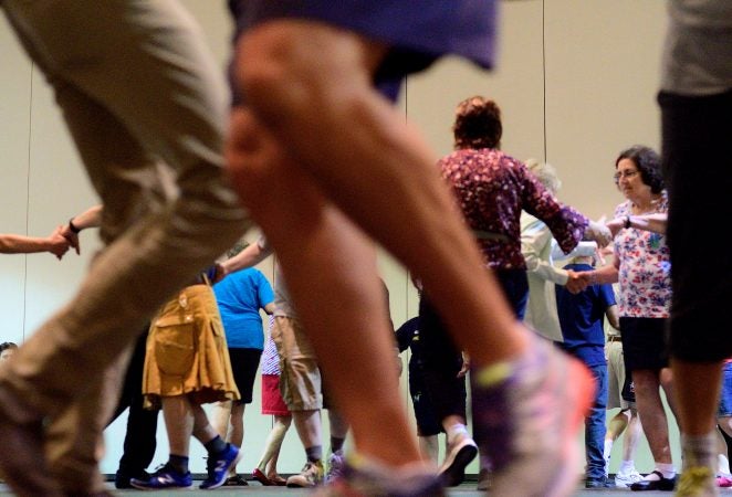 A Center City hotel ballroom is the stage for the 36th LGBT Square Dance Convention. The annual event is organized by the International Association of Gay Square Dance Clubs. (Bastiaan Slabbers for WHYY)