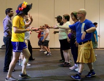 A Center City hotel ballroom is the stage for the 36th LGBT Square Dance Convention. The annual event is organized by the International Association of Gay Square Dance Clubs. (Bastiaan Slabbers for WHYY)
