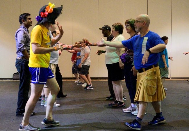 A Center City hotel ballroom is the stage for the 36th LGBT Square Dance Convention. The annual event is organized by the International Association of Gay Square Dance Clubs. (Bastiaan Slabbers for WHYY)