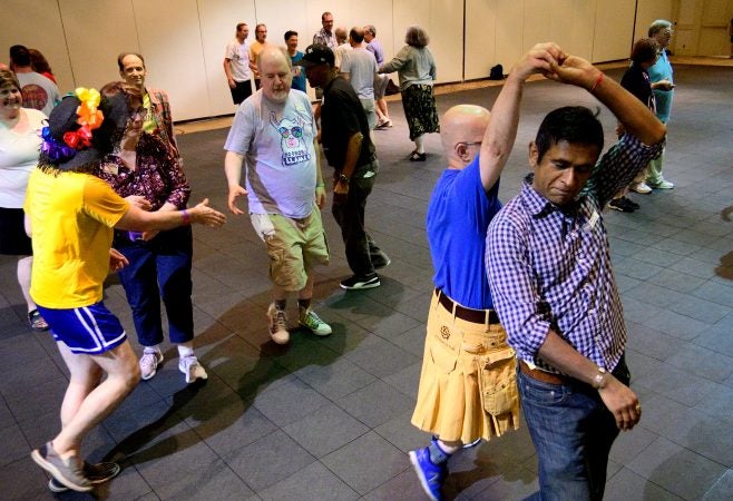 A Center City hotel ballroom is the stage for the 36th LGBT Square Dance Convention. The annual event is organized by the International Association of Gay Square Dance Clubs. (Bastiaan Slabbers for WHYY)