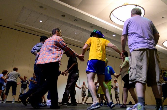 A Center City hotel ballroom is the stage for the 36th LGBT Square Dance Convention. The annual event is organized by the International Association of Gay Square Dance Clubs. (Bastiaan Slabbers for WHYY)