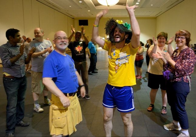 Marilyn 'Zip' Warmerdam receives cheers after calling a fifteen minute tip during the 36th LGBT Square Dance Convention. The annual event is organized by the International Association of Gay Square Dance Clubs. (Bastiaan Slabbers for WHYY)