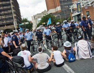 Protesters found a way around the police barricade and blocked Philadelphia’s Fourth of July Parade. (Kimberly Paynter/WHYY)