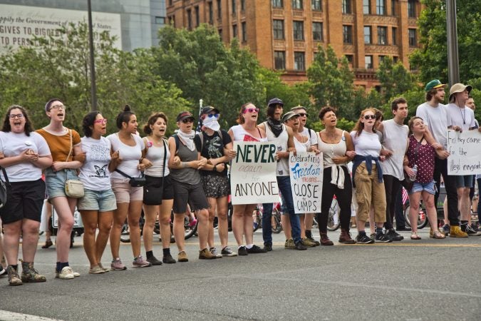 Protesters found a way around the police barricade and blocked Philadelphia’s Fourth of July Parade. (Kimberly Paynter/WHYY)