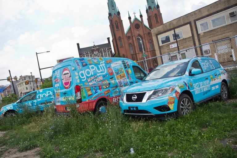 A small fleet of goPuff delivery vehicles, parked outside their Philadelphia headquarters. (Kimberly Paynter/WHYY)