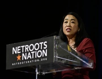 Councilmember Helen Gym takes the stage ahead of the Netroots Nation presidential candidate forum at the Convention Center in Philadelphia on July 13, 2019. (Bastiaan Slabbers for WHYY)