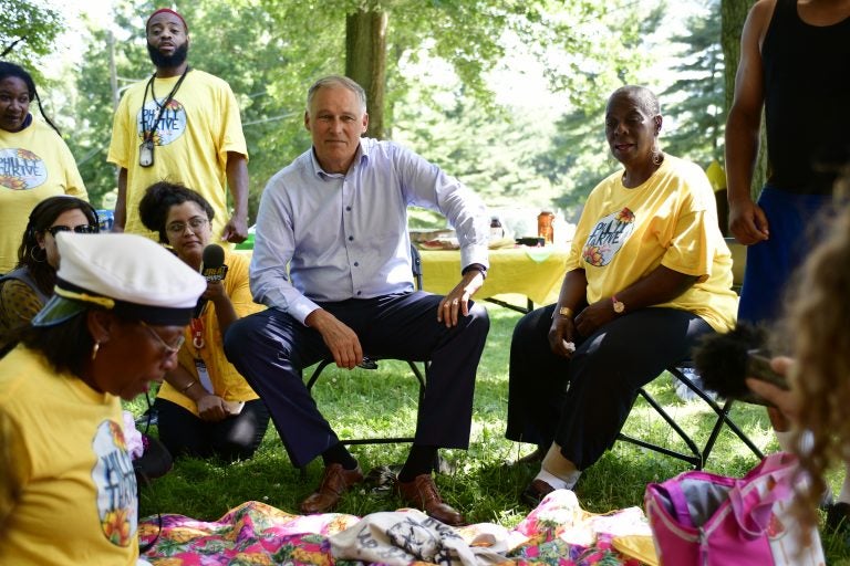 Democratic presidential hopeful Jay Inslee joins activist with Philly Thrive for a community BBQ, in Fairmount park, on Saturday. (Bastiaan Slabbers for WHYY)