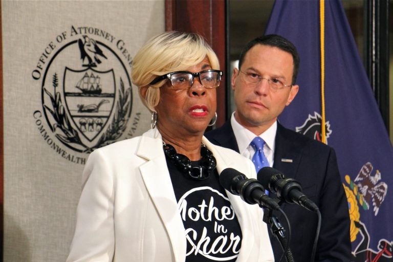 With tear-filled eyes, Mothers in Charge Executive Director Dorothy Johnson-Speight joins Pennsylvania Attorney Genteral Josh Shapiro to announce grant funding for Operation LIPSTICK, aimed at educating women about the dangers of straw purchases. Johnson-Speight's son was killed with a gun purchased by the shooter's girlfriend