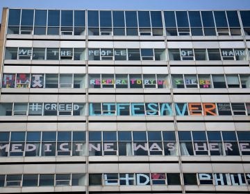 Hahnemann Hospital windows are decorated by employees as the hospital prepares to close. (Emma Lee/WHYY)