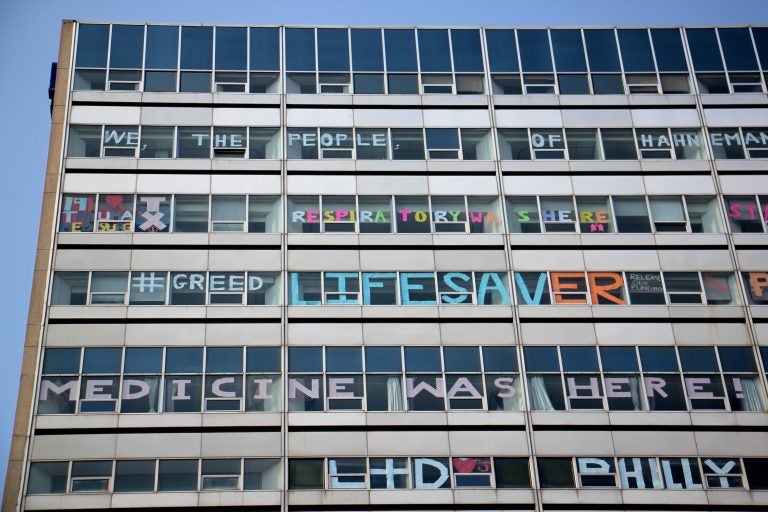 Hahnemann Hospital windows are decorated by employees as the hospital prepares to close. (Emma Lee/WHYY)