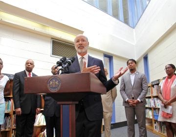 Gov. Tom Wolf visits the newly painted library at Edward Heston School in Philadelphia to announce $4.3 million in state funding for lead paint stabilization at Philadelphia school buildings. (Emma Lee/WHYY)