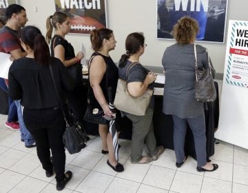 In this Tuesday, Oct. 3, 2017, photo, job seekers wait in line at a job fair (Alan Diaz/AP Photo)